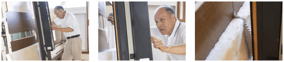 職人が、ウールボードを大型パネルソーで裁断する様子